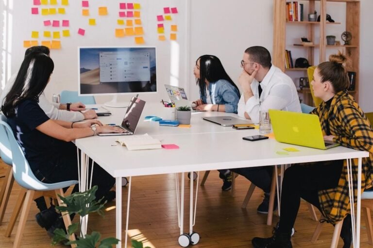 A team in an office discussing intelligent search during a meeting